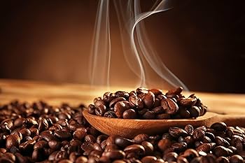 Freshly roasted coffee beans with rising aroma
